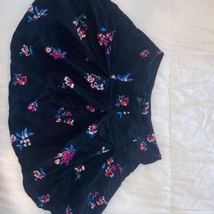 Beautiful, feminine, floral skirt. Black with colorful printed flowers. Size M.